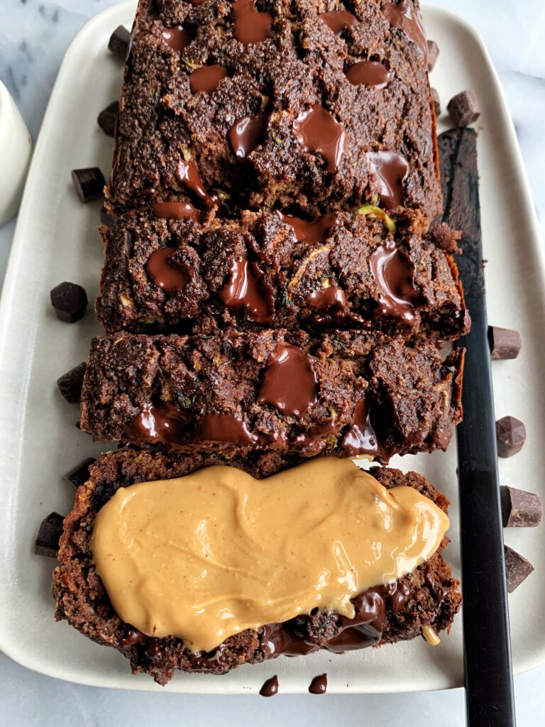 Delicious Paleo Chocolate Zucchini Bread made with all gluten-free and diary-free ingredients! An easy and healthy zucchini bread recipe with a chocolatey twist and lower in sugar.
