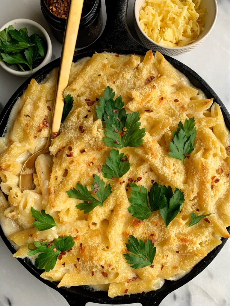 The BEST Gluten-free Baked Mac and Cheese ever. This is our family's favorite recipe to make and you only need a few healthier ingredients. Plus the creamy coconut milk is the ultimate secret ingredient here!