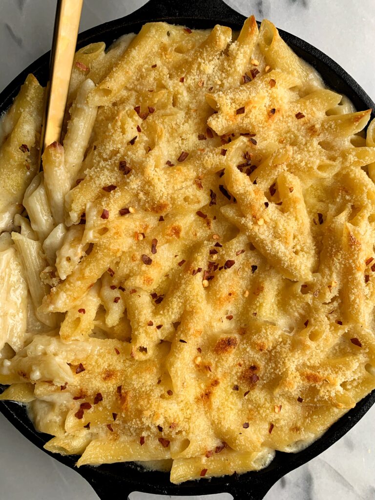 The BEST Gluten-free Baked Mac and Cheese ever. This is our family's favorite recipe to make and you only need a few healthier ingredients. Plus the creamy coconut milk is the ultimate secret ingredient here!