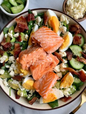 A Delicious Salmon Cobb Salad for a twist on the classic cobb salad recipe. One of our favorite go-to salads to make and pair with any dressing you're are craving!