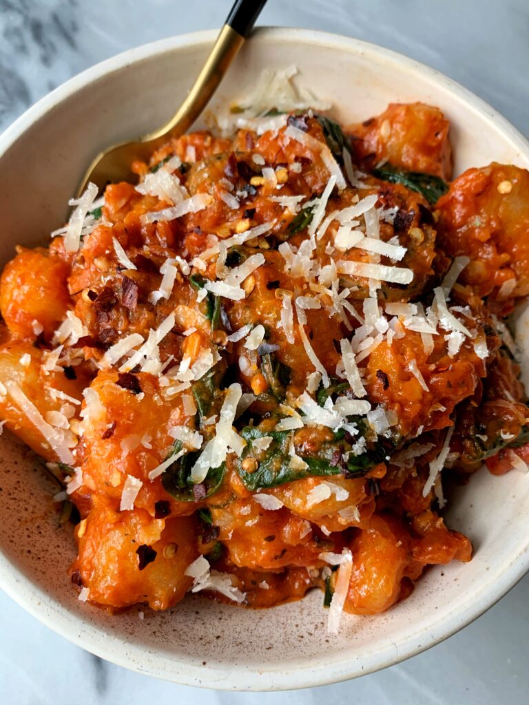 One-Skillet Cauliflower Gnocchi with Sausage + Spinach for an easy and healthy dinner that only takes 10 minutes to whip up! 