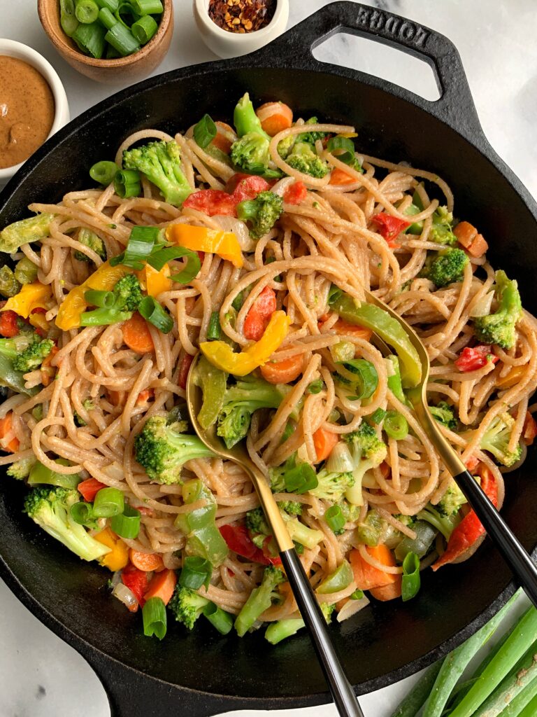 These Vegan Almond Butter Stir Fry Noodles are one of the easiest meals to whip up for a healthy lunch or dinner that takes less then 15 minutes to make! Tossed in a dreamy almond butter sauce.