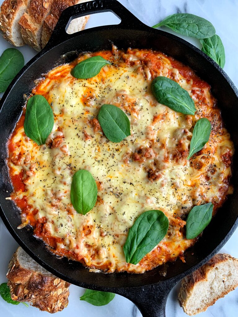 This Spaghetti Squash Casserole is hands down one of the easiest and most delicious heathy dinner ideas. It is gluten-free, made with only 4 ingredients and you only need one skillet to make it.