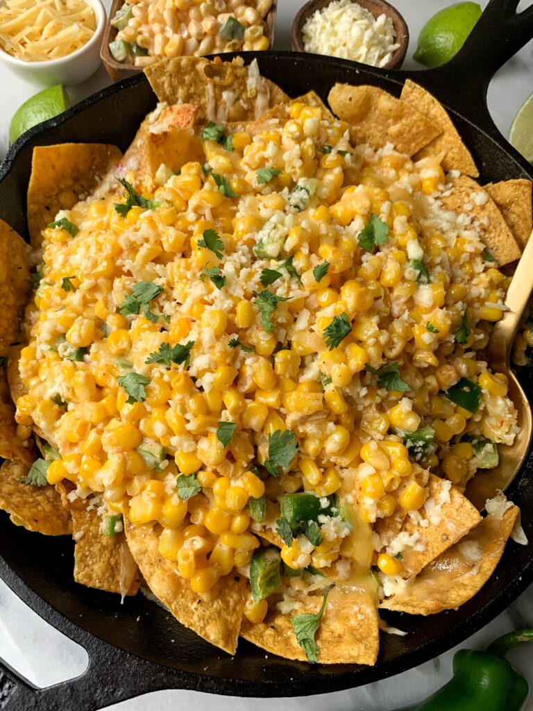 INSANE Mexican Street Corn Taco Casserole! This dish is beyond drool worthy and it is one of those ridiculously easy recipes to make that just so happens to be gluten-free and made with healthier ingredients than the usual Mexican Street Corn.