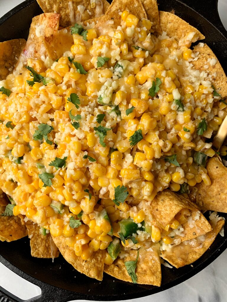 INSANE Mexican Street Corn Taco Casserole! This dish is beyond drool worthy and it is one of those ridiculously easy recipes to make that just so happens to be gluten-free and made with healthier ingredients than the usual Mexican Street Corn.