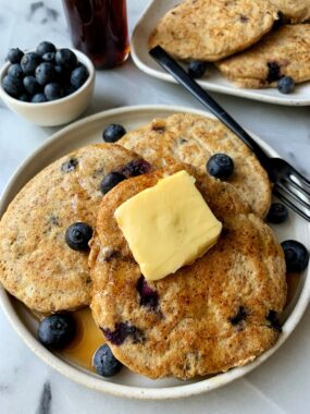 The Absolute BEST Paleo Blueberry Pancakes made with only a few ingredients. This healthy gluten-free pancake recipe is seriously a game changer and takes only 10 minutes to whip up.