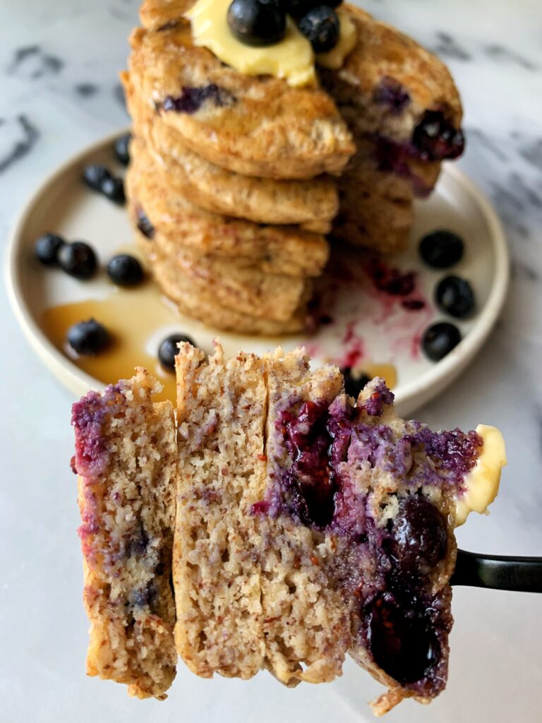 The Absolute BEST Paleo Blueberry Pancakes made with only a few ingredients. This healthy gluten-free pancake recipe is seriously a game changer and takes only 10 minutes to whip up.