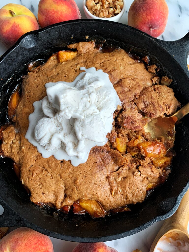 The Best Vegan Gluten-free Peach Cobbler made with just a few simple ingredients. This cobbler is insanely delicious, easy to make and is the ultimate healthy peach cobbler to pair with a scoop of ice cream.