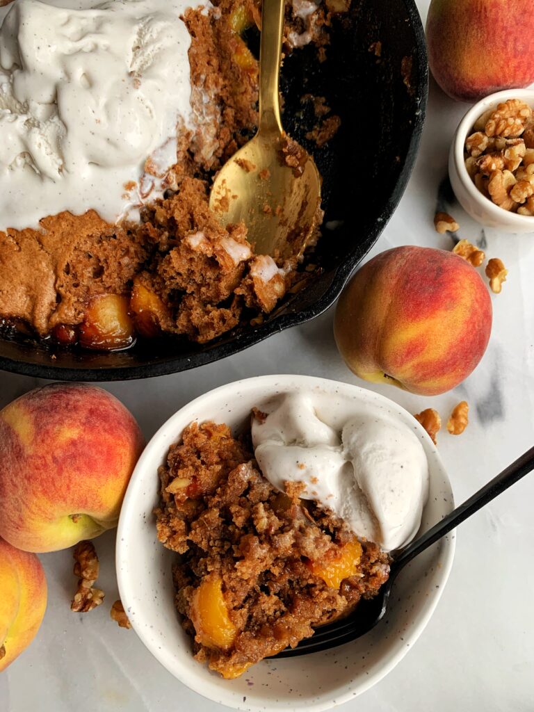 The Best Vegan Gluten-free Peach Cobbler made with just a few simple ingredients. This cobbler is insanely delicious, easy to make and is the ultimate healthy peach cobbler to pair with a scoop of ice cream.