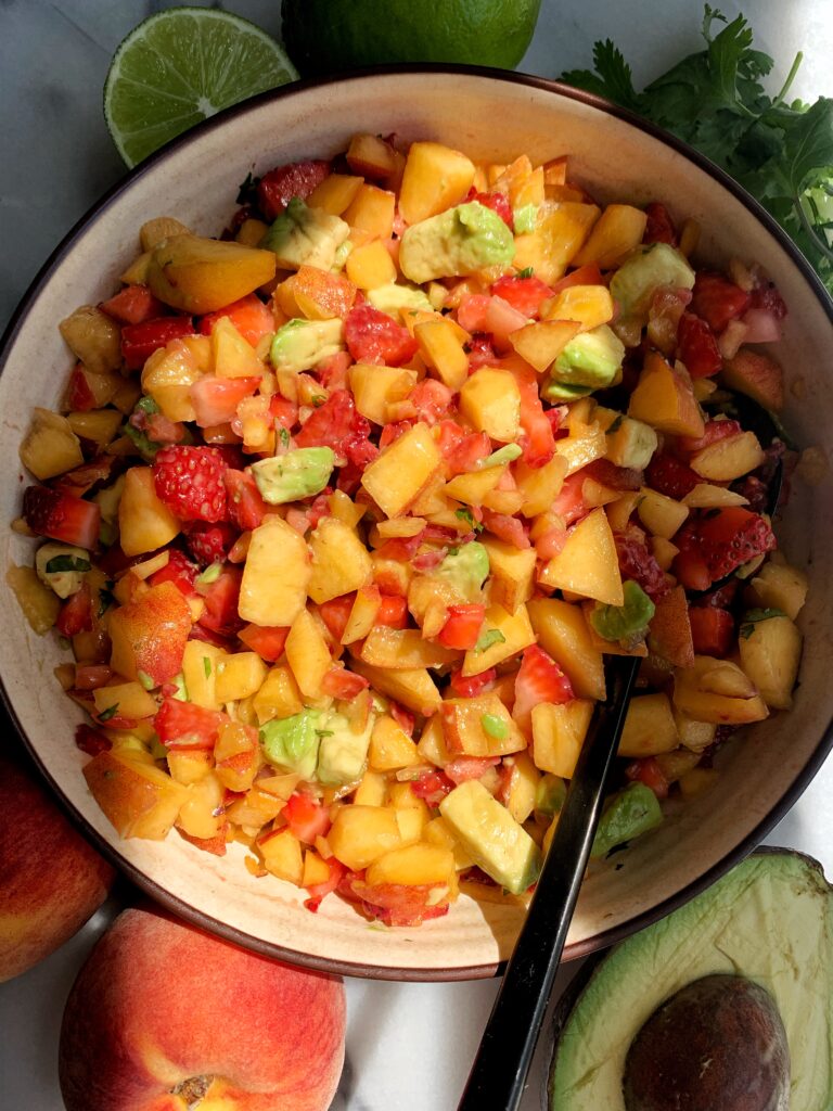 Dreamy Peach Strawberry Avocado Salsa made with only 5 ingredients and takes 10 minutes to make. Breakout your favorite chips and enjoy your new favorite (no onion) summery healthy salsa!