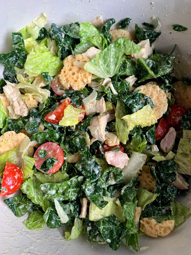 This Copycat Sweetgreen Kale Caesar Salad is basically better than the real deal. Super simple and easy to make and you will think you are at your favorite salad joint eating it!