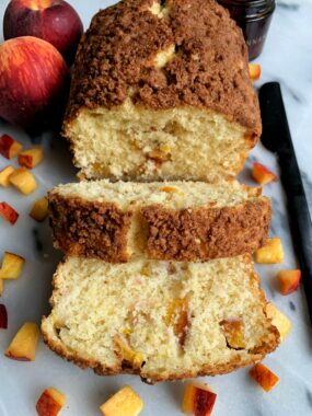 Delicious Peach Crumb Pancake Bread made with my favorite pancake mix and topped with a pancake crumb cake topping and filled with fresh peaches for a perfect peach season recipe.