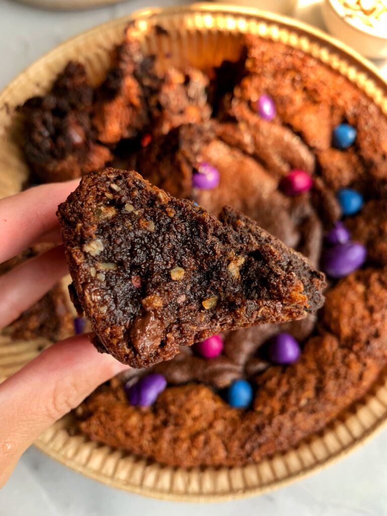 INSANE Monster Cookie Brownie Pie! The most delicious best of both worlds dessert with a gluten-free monster cookie base and filled with fudgy brownies.