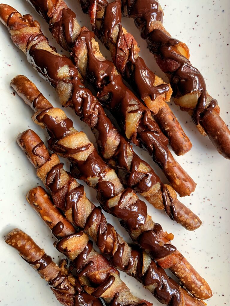 These Chocolate Bacon Wrapped Pretzels are GOLDEN! And one of our favorite sweet and savory snacks to munch on right now.