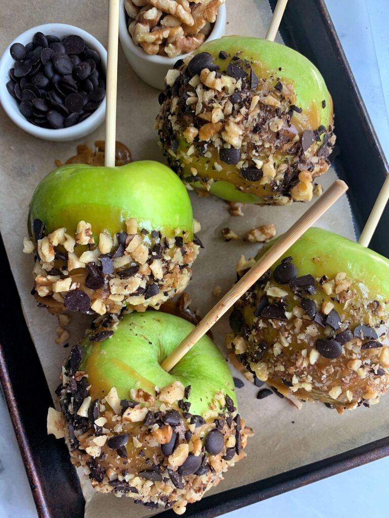Easy and Delicious Paleo Caramel Apples made with a homemade vegan caramel sauce. Such an epic version with lower sugar than the usual candy apples yet still insanely tasty and addicting.