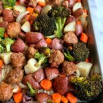 Let's make this Sheet Pan Sausage Dinner! A healthy and easy recipe to make that requires one baking sheet, sausage and veggies!