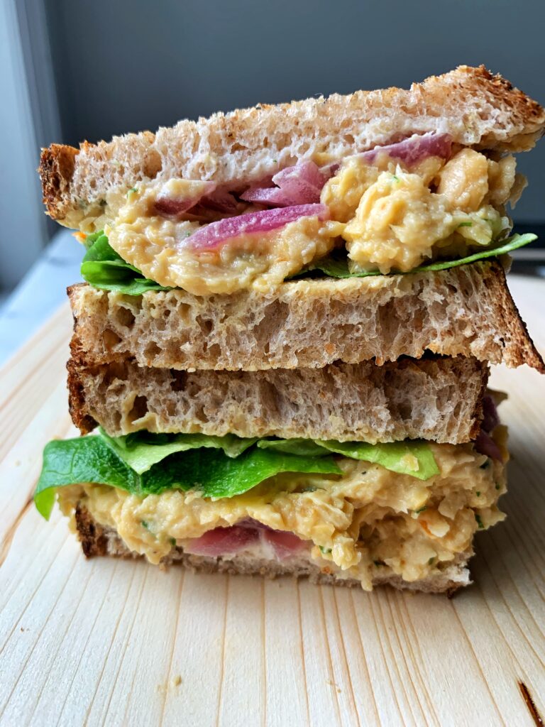 The absolute best vegan Chickpea Salad Sandwich! This is such an easy and delicious plant-based recipe to make for lunch or dinner and it comes together in 5 minutes.