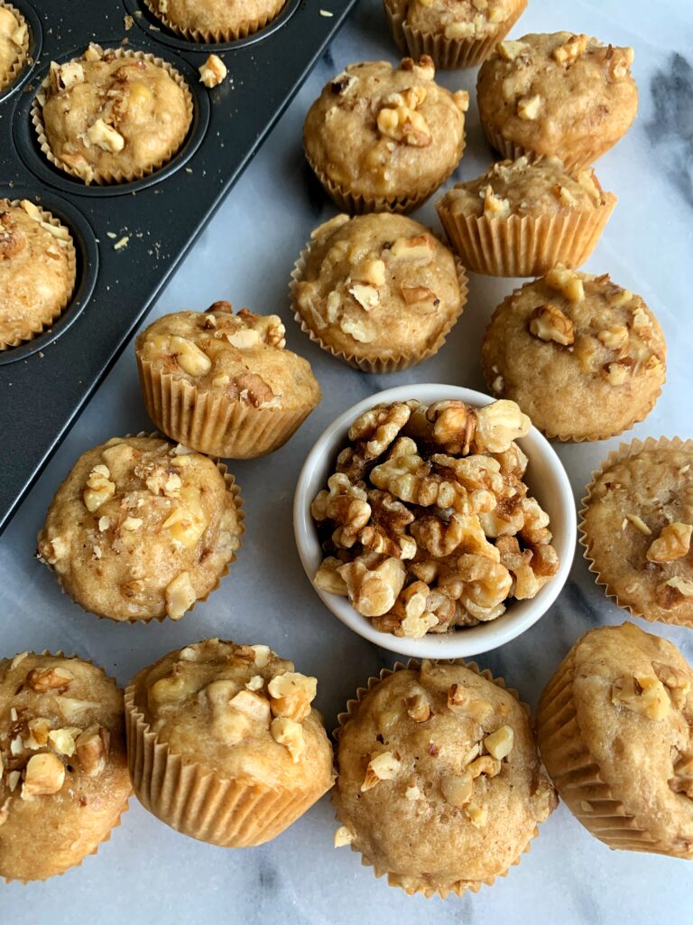 EPIC Gluten-free Mini Banana Walnut Muffins that remind me of those cutie Little Bites muffins I used to eat growing up. Except these are gluten-free, dairy-free and lower in sugar baby!