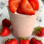 The Best Strawberries and Cream Smoothie to start your mornings with. Or even enjoy as a dessert or snack. Filled with delicious ingredients and it's dairy-free, gluten-free and toddler approved.