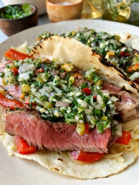 Epic Grill Pan Steak Tacos with Chimichurri Sauce! These are the ultimate steak tacos guys and you don't even need a grill to whip them up plus they're paleo and gluten-free.