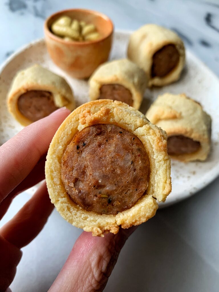 Sharing these Paleo Pigs in a Blanket Sausage Style! These are the ultimate "healthier" pigs in a blanket and we use sausage instead of hot dogs to spice things up a bit. 