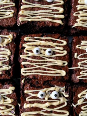 Delicious Halloween Mummy Brownies! These are the cutest brownie recipe to make for Halloween and they're kid-friendly and easy to make!