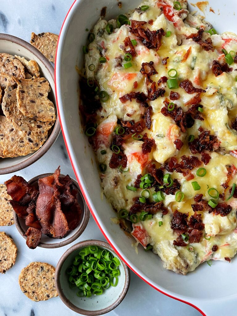 Sharing how to make this easy baked Bacon and Crab Dip. The most flavorful and *addicting* appetizer to make and serve that takes just 25 minutes to cook.