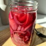 Here's how to make your own pickled red onions. Hands down my favorite to add to salads, sandwiches and burgers. It is so easy to make these at home.