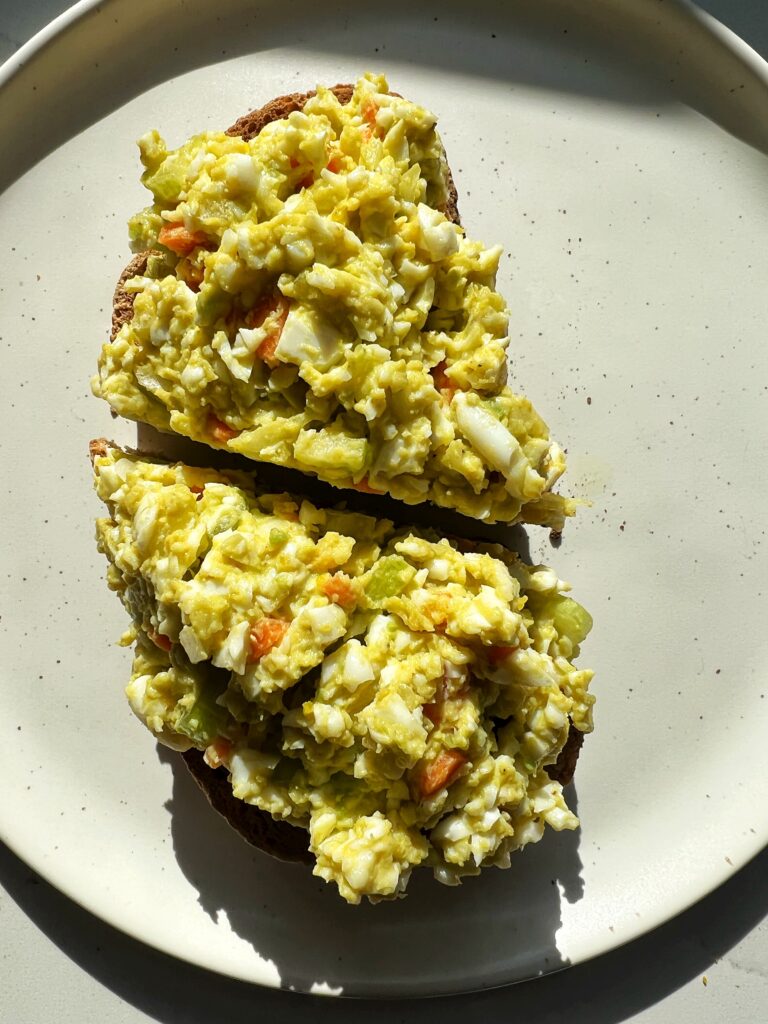 This is the ultimate dairy-free egg salad made with no mayo, no yogurt and instead we use some mashed avocado. This healthy lunch recipe is Whole30 and a staple in my weekly meal prep.