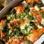 Sharing our favorite Pesto Lasagna Roll Ups recipe. They are gluten-free, easy to make and one our family's favorite recipes to make. Filled with sauce, beef, pesto, and cheese.
