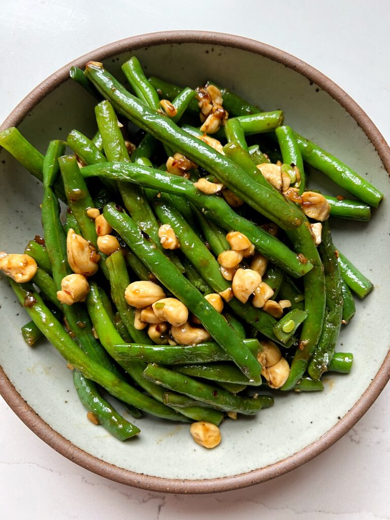 These Copycat P.F. Chang's Spicy Green Beans are the ultimate green bean recipe to make. Plus they only take 10 minutes to whip up and they're gluten-free, vegan and a healthier version of the original.