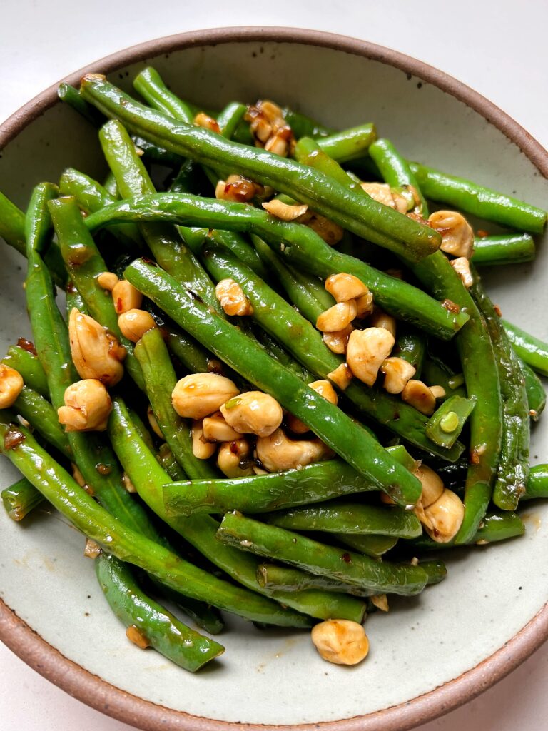 These Copycat P.F. Chang's Spicy Green Beans are the ultimate green bean recipe to make. Plus they only take 10 minutes to whip up and they're gluten-free, vegan and a healthier version of the original.