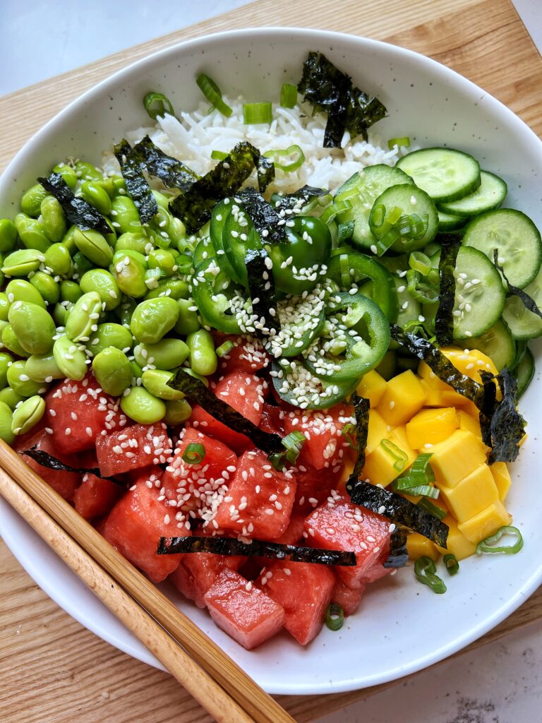 In a medium bowl add the watermelon In a small bowl, whisk together coconut aminos, sesame oil, rice vinegar and salt and pepper Pour on top of watermelon to mix well and allow the watermelon to marinate for about 10-15 minutes Assemble poke bowls by evenly distributing ingredients to 2 bowls and enjoy!