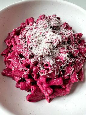 My favorite Beet Pesto recipe that is made with gluten-free ingredients and takes 5 minutes to make. This recipe pairs perfectly with your favorite pasta, pizza or as a dip.