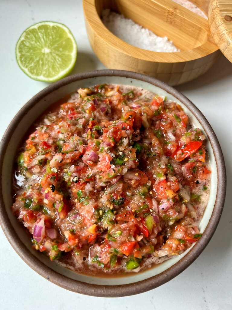The Best 5-minute Homemade Salsa Recipe to make and serve all year long. This is a family favorite and it is SO easy to make and serve with your go-to chips, with tacos, anything you'd like!