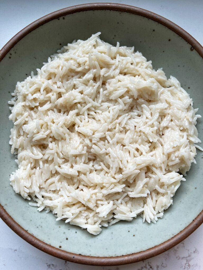 Here is how to make the most delicious Creamy Coconut Rice! Such a flavorful recipe to make and you only need 3 ingredients to make it.