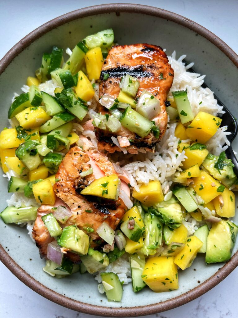 These Coconut Rice Salmon Bowls with Mango Salsa are the ultimate delicious and healthy dinner recipe to make. All of the recipes are gluten-free, dairy-free and this combination is too die for.