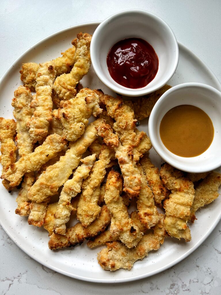 Crispy Gluten-free Chicken Fries! These chicken "fries" are the ultimate crispy chicken recipe to make and dip in your favorite condiments and sauces.