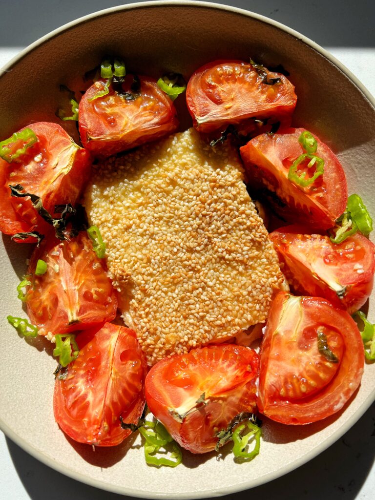 This Baked Feta with Sesame Seeds is the ultimate cheesy appetizer. Oven-baked block of feta, coated in sesame seeds for a crispy and delicious way to serve and enjoy feta cheese!