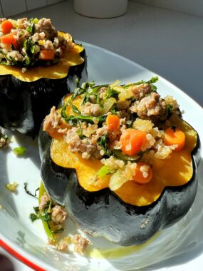 Try this Stuffed Acorn Squash recipe next time you are looking for a healthy and hearty dinner idea! Made with all gluten-free ingredients and filled with quinoa, sausage and vegetables.