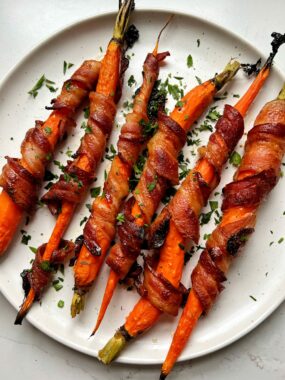 These Maple Bacon Wrapped Carrots are the ultimate side dish to make to spice up your carrots! Made with just 4 ingredients and this recipe is gluten-free and dairy-free.