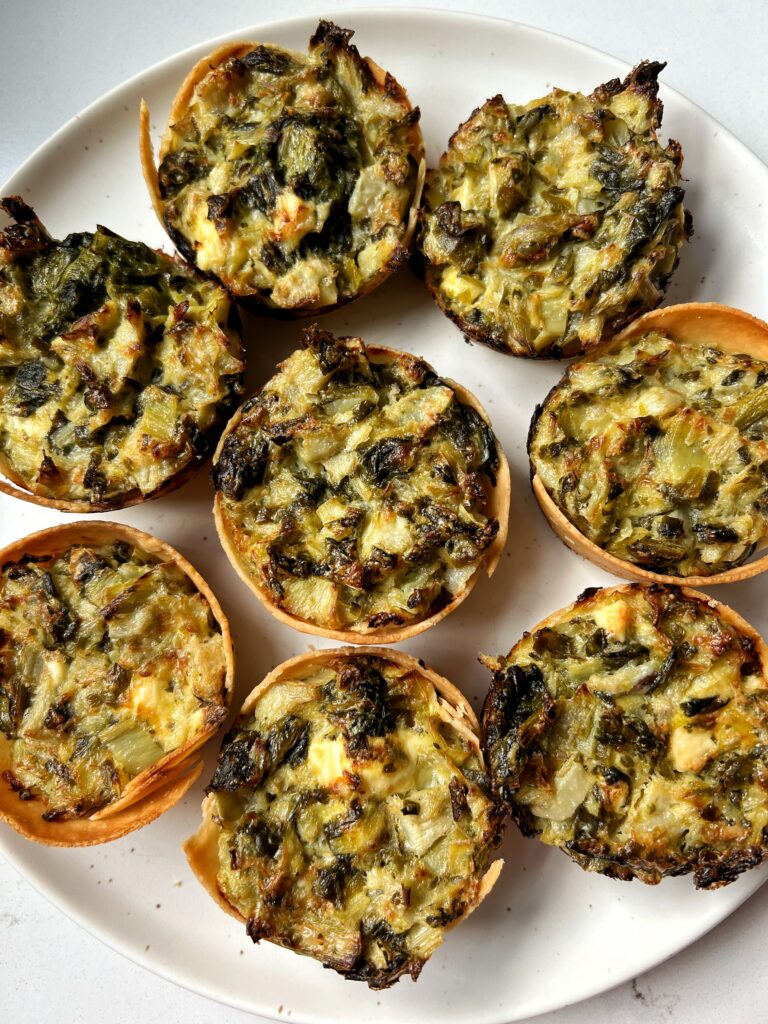These Spinach Artichoke Dip Cups are a delicious cheesy appetizer to make to switch things up from your usual spinach artichoke dip! Made with all gluten-free ingredients and ready in 15 minutes.