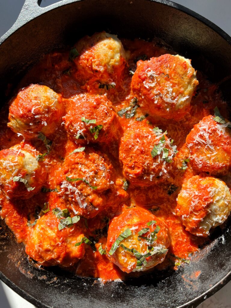 These Chicken Parmesan Meatballs are the ultimate easy dinner recipe. Made with all gluten-free and grain-free ingredients for an easy 30 minute meal to make.