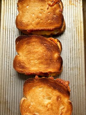Once you try sheet pan grilled cheese - you will become obsessed! The best way to make grilled cheese sandwiches for a group and it gets extra crispy and is still oozing with cheesy in the center.