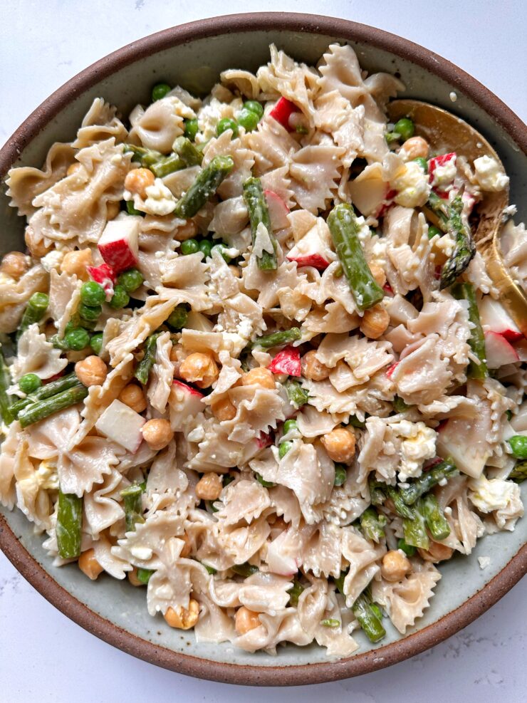 This Spring Pasta Salad is the ultimate seasonal pasta salad to make. Tossed in a delicious lemon dijon dressing and ready in under 20 minutes!