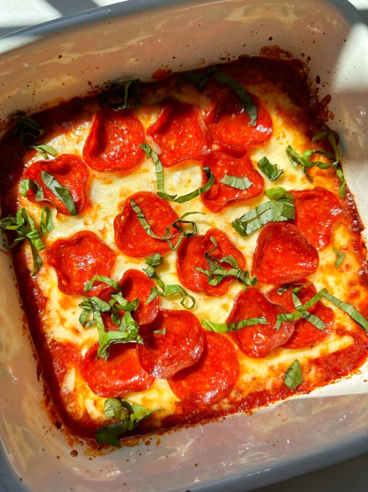 This oven-baked Pizza Dip is layered with just a few ingredients like sauce, mozzarella cheese, pepperoni and drizzled with some hot honey on top! It makes a great appetizer and taste delicious with your go-to bread or pizza crust.