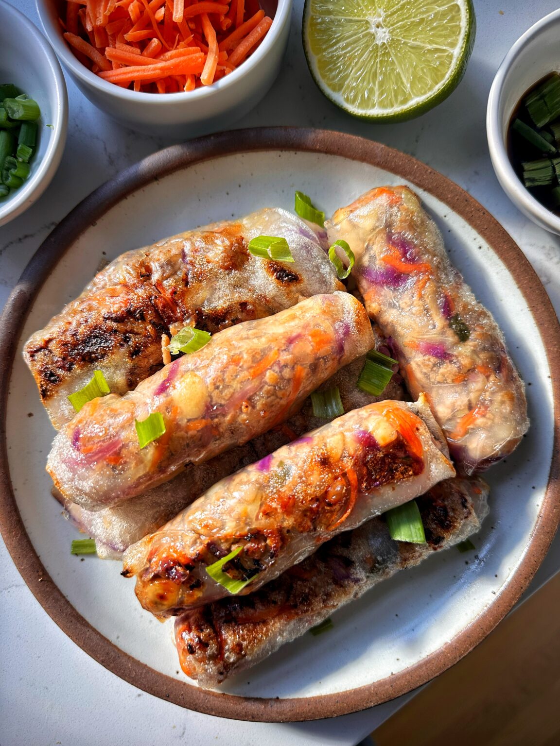 Air fryer crispy spring rolls with chicken and vegetables served with sweet chili dipping sauce